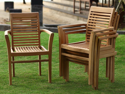 Three Oval 120-170cm Extending 2 Seat Stacking & 4 Folding Chairs arranged on grass, two facing forward and one angled to the side, in an outdoor garden setting.