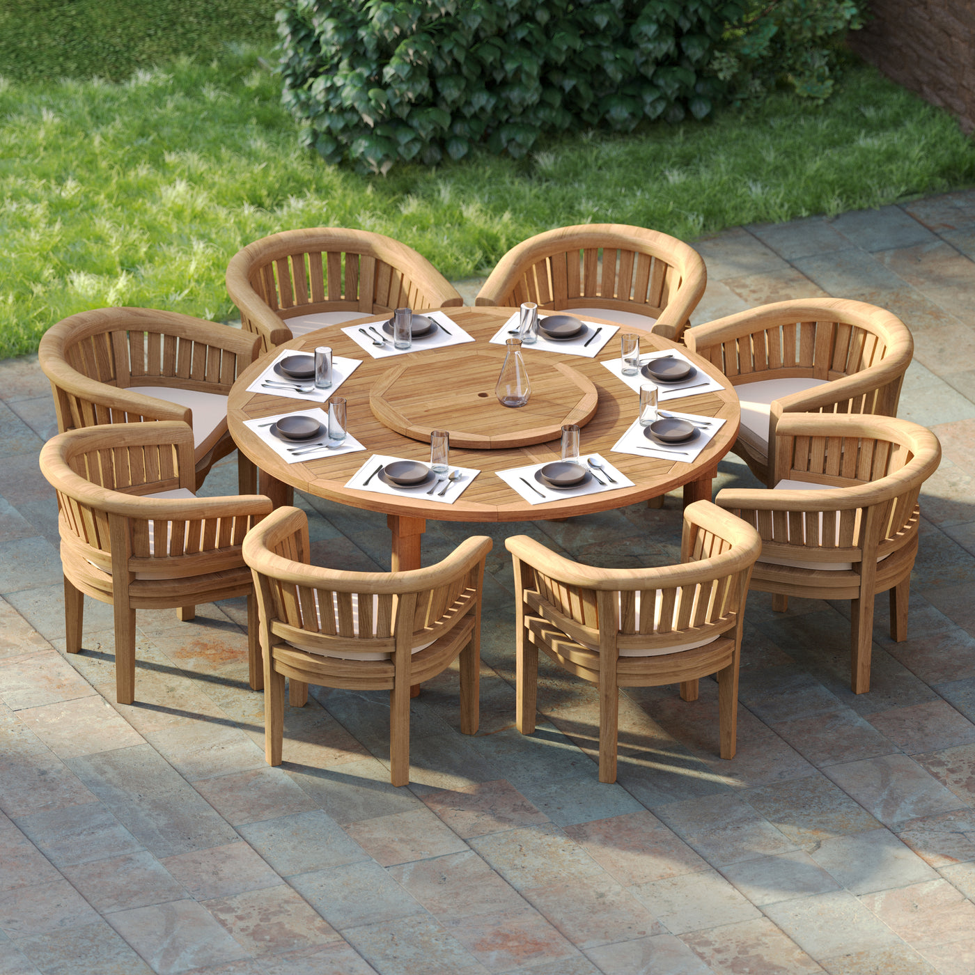 Top-down view of 180cm round teak garden table surrounded by 8 San Francisco chairs with cream cushions.
