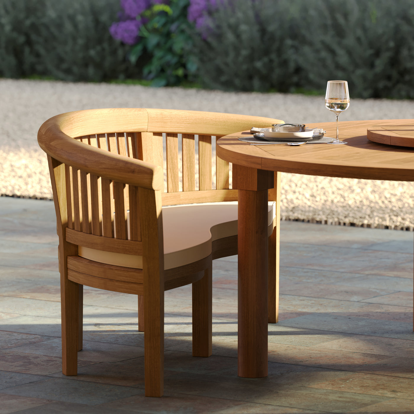 San Francisco bench with plush cushions around large round garden table