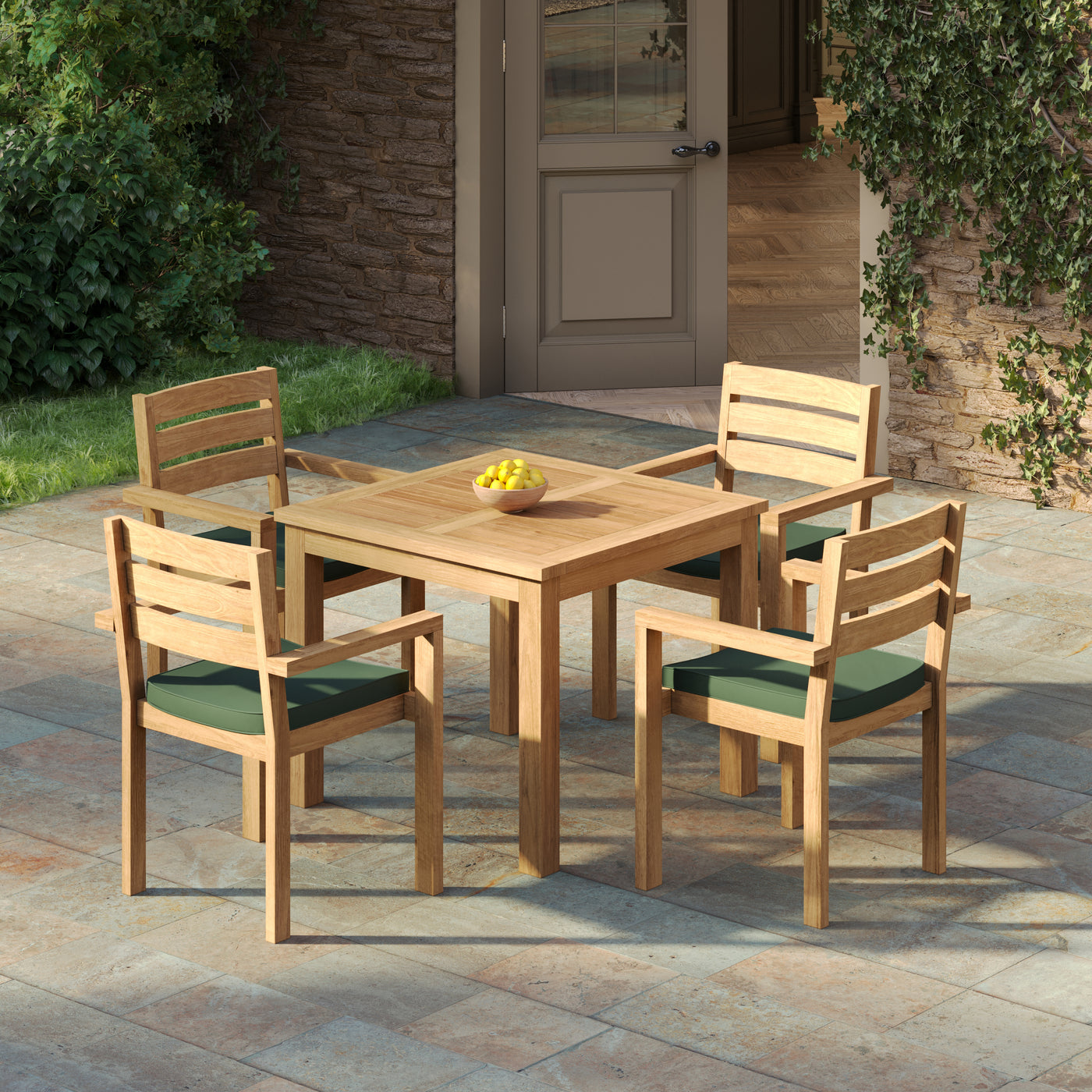 Compact teak outdoor dining set arranged for four on brick patio