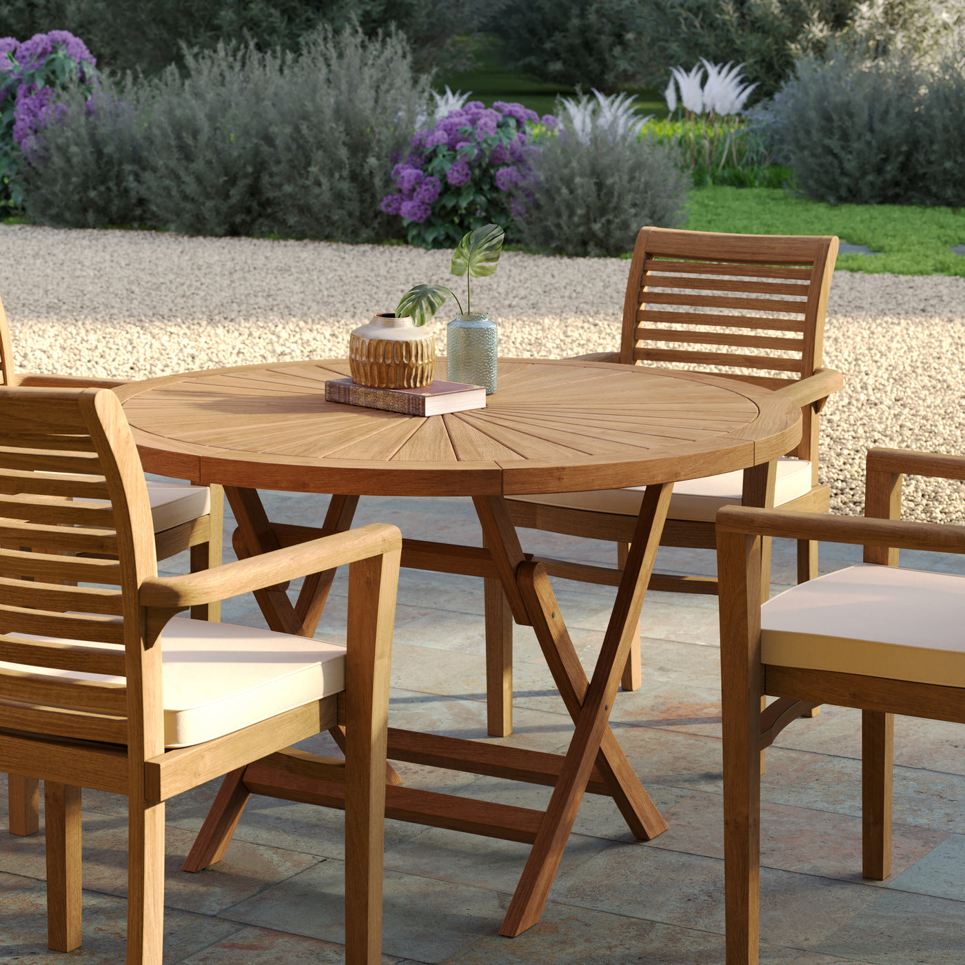 Teak garden furniture set highlighting the radial slat design of the 120cm round Sunshine table and Oxford stacking chairs.