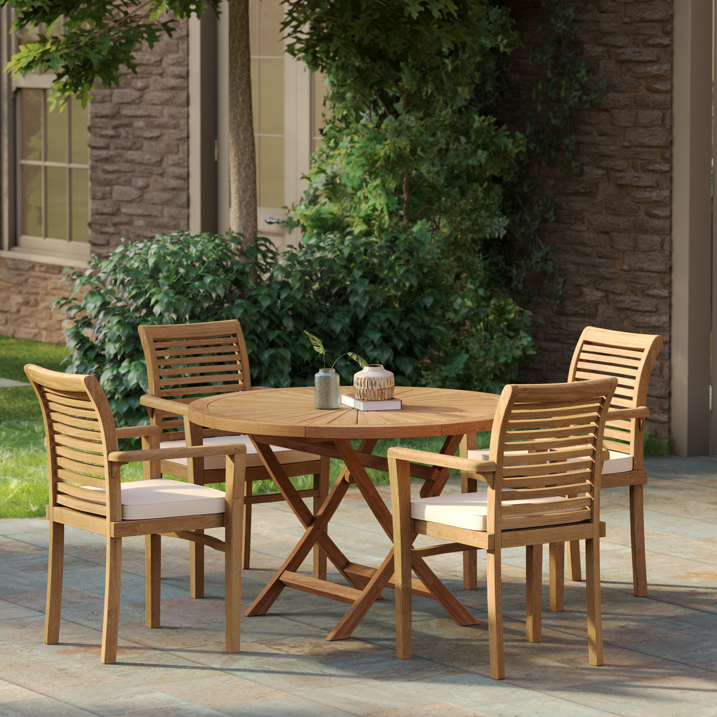 Folded 120cm round Sunshine teak table and stacked Oxford chairs demonstrating the space-saving feature of the teak garden outdoor set.